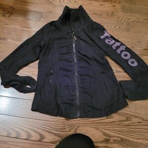 TATTOO Zip up, writing on sleeve, in Excellent condition.